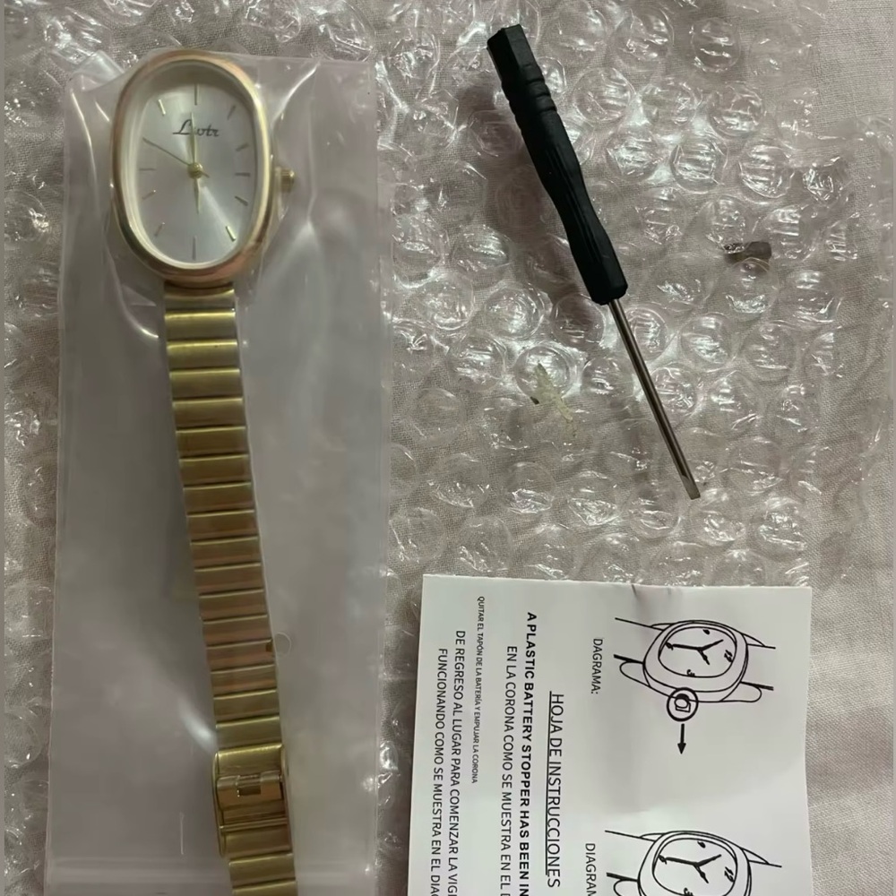 Gold Akribos Watch with Oval Face